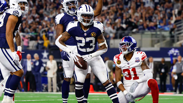 Nov 28, 2024; Arlington, Texas, USA; Dallas Cowboys running back Rico Dowdle (23) rushes for a touchdown during the third quarter against the New York Giants at AT&T Stadium. Mandatory Credit: Andrew Dieb-Imagn Images