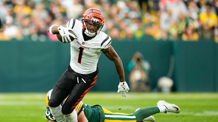 Oct 12, 2025; Green Bay, Wisconsin, USA; Cincinnati Bengals wide receiver Ja'Marr Chase (1) is tackled by Green Bay Packers safety Evan Williams (33) in the third quarter at Lambeau Field. Mandatory Credit: Kayla Wolf-Imagn Images Oct 12, 2025; Green Bay, Wisconsin, USA; Cincinnati Bengals wide receiver Ja'Marr Chase (1) is tackled by Green Bay Packers safety Evan Williams (33) in the third quarter at Lambeau Field. Mandatory Credit: Kayla Wolf-Imagn Images