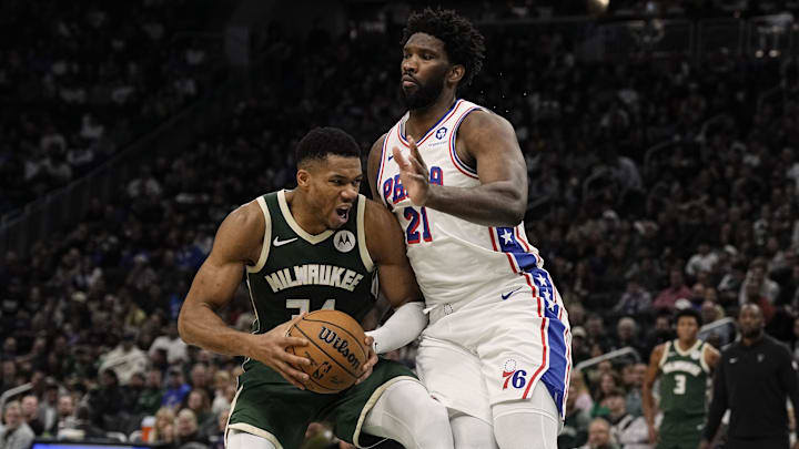 Oct 26, 2023; Milwaukee, Wisconsin, USA;  Milwaukee Bucks forward Giannis Antetokounmpo (34) looks to shoot agasint Philadelphia 76ers center Joel Embiid (21) during the second quarter at Fiserv Forum. Mandatory Credit: Jeff Hanisch-Imagn Images