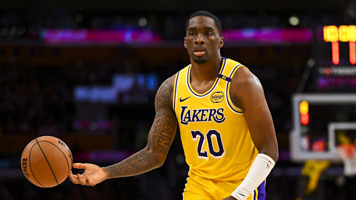 Mar 20, 2025; Los Angeles, California, USA; Los Angeles Lakers guard Shake Milton (20) passes against the Milwaukee Bucks during the second half at Crypto.com Arena. Mandatory Credit: Jonathan Hui-Imagn Images