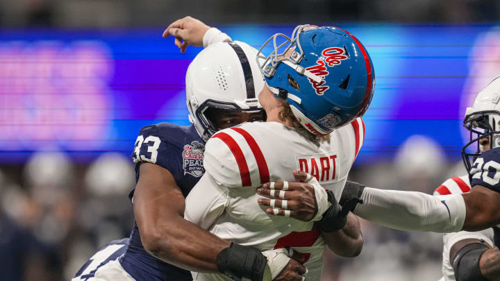 Penn State Nittany Lions defensive end Dani Dennis-Sutton hits Mississippi Rebels quarterback Jaxson Dart during the Peach Bowl. Penn State Nittany Lions defensive end Dani Dennis-Sutton hits Mississippi Rebels quarterback Jaxson Dart during the Peach Bowl.
