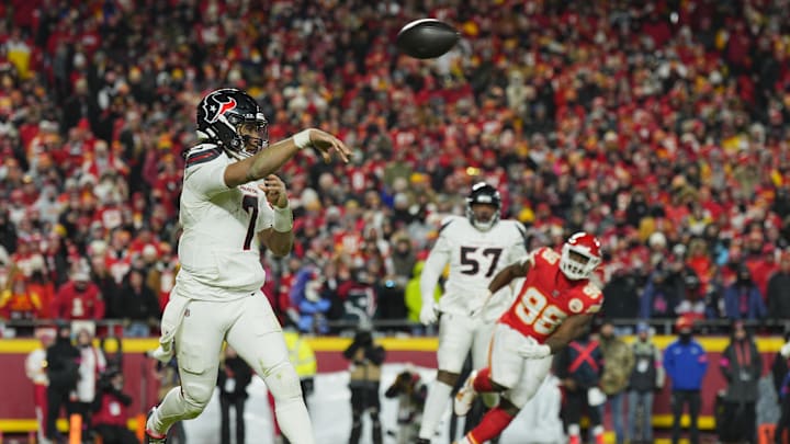 Jan 18, 2025; Kansas City, Missouri, USA; Houston Texans quarterback C.J. Stroud (7) throws on the run against the Kansas City Chiefs during the fourth quarter of a 2025 AFC divisional round game at GEHA Field at Arrowhead Stadium. Mandatory Credit: Jay Biggerstaff-Imagn Images