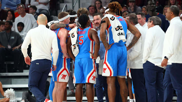 Jan 18, 2025; Starkville, Mississippi, USA; Mississippi Rebels head coach Chris Beard huddles with his team during the first half against the Mississippi State Bulldogs at Humphrey Coliseum. Mandatory Credit: Petre Thomas-Imagn Images