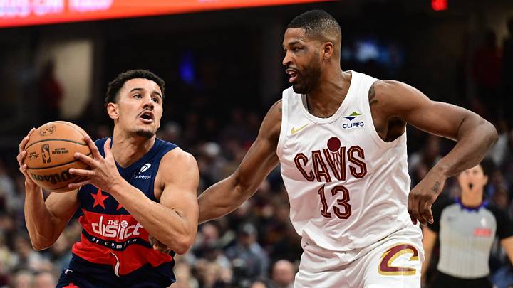 Dec 13, 2024; Cleveland, Ohio, USA; Washington Wizards guard Johnny Davis (1) drives to the basket against Cleveland Cavaliers center Tristan Thompson (13) during the first half at Rocket Mortgage FieldHouse. Mandatory Credit: Ken Blaze-Imagn Images