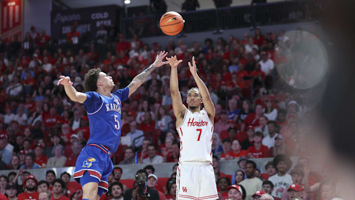 Mar 3, 2025; Houston, Texas, USA; Houston Cougars guard Milos Uzan (7) shoots the ball as Kansas Jayhawks guard Zeke Mayo (5) defends during the second half at Fertitta Center. Mandatory Credit: Troy Taormina-Imagn Images Mar 3, 2025; Houston, Texas, USA; Houston Cougars guard Milos Uzan (7) shoots the ball as Kansas Jayhawks guard Zeke Mayo (5) defends during the second half at Fertitta Center. Mandatory Credit: Troy Taormina-Imagn Images