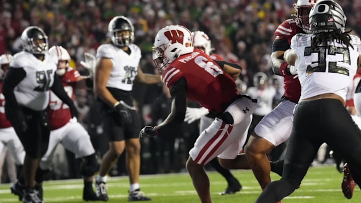 Nov 16, 2024; Madison, Wisconsin, USA;  Wisconsin Badgers wide receiver Will Pauling (6) scores a touchdown during the second quarter against the Oregon Ducks at Camp Randall Stadium. Mandatory Credit: Jeff Hanisch-Imagn Images