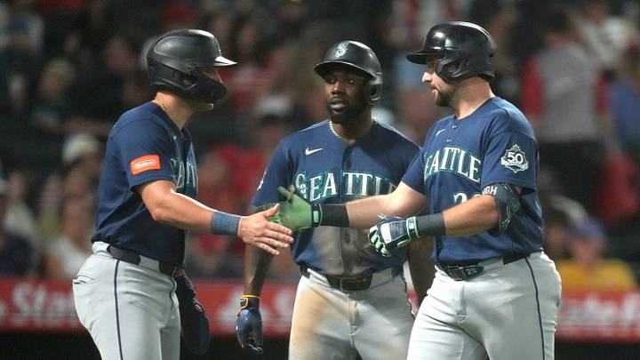 Sep 14, 2026; Anaheim, California, USA; Seattle Mariners catcher Cal Raleigh (29) is congratulated by right fielder Dominic Canzone (8) and left fielder Randy Arozarena (56) after hitting a three-run home run in the fourth inning against the Los Angeles Angels at Angel Stadium. Mandatory Credit: Kirby Lee-Imagn Images Sep 14, 2026; Anaheim, California, USA; Seattle Mariners catcher Cal Raleigh (29) is congratulated by right fielder Dominic Canzone (8) and left fielder Randy Arozarena (56) after hitting a three-run home run in the fourth inning against the Los Angeles Angels at Angel Stadium. Mandatory Credit: Kirby Lee-Imagn Images