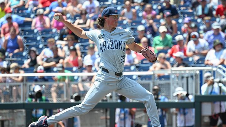 Jun 15, 2025; Omaha, Neb, USA;  Arizona Wildcats starting pitcher Smith Bailey (22) throws against the Louisville Cardinals during the first inning at Charles Schwab Field. Mandatory Credit: Steven Branscombe-Imagn Images