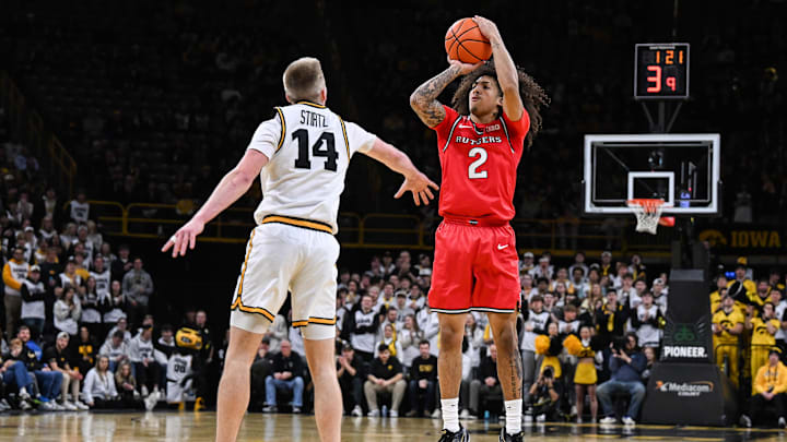 Jan 20, 2026; Iowa City, Iowa, USA; Rutgers Scarlet Knights guard Lino Mark (2) shoots the ball over Iowa Hawkeyes guard Bennett Stirtz (14) during the first half at Carver-Hawkeye Arena. Mandatory Credit: Jeffrey Becker-Imagn Images