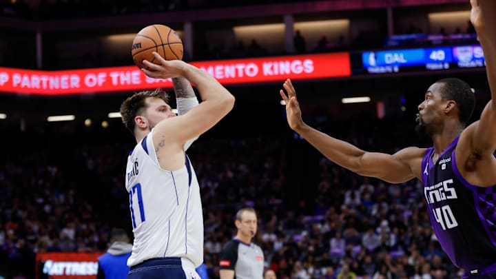 Mar 26, 2024; Sacramento, California, USA; Dallas Mavericks guard Luka Doncic (77) shoots the ball