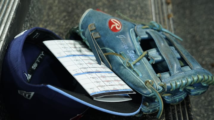 The glove, player information card and hat of Toronto Blue Jays right fielder George Springer (not pictured) in the dugout of a game against the Los Angeles Dodgers at Rogers Centre.