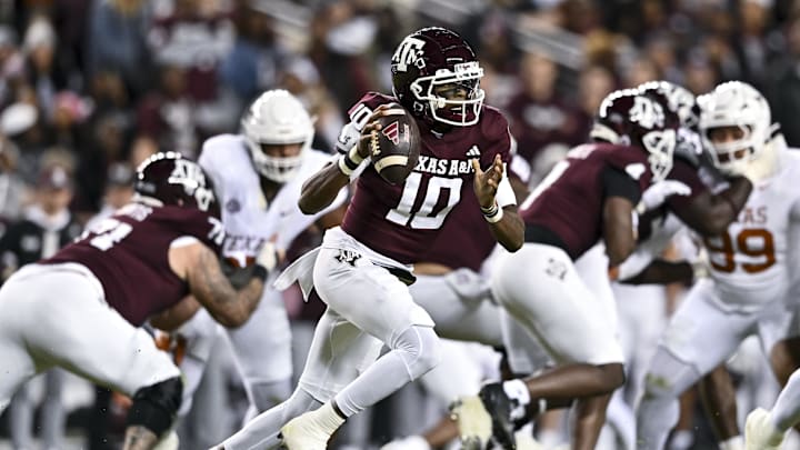 Nov 30, 2024; College Station, Texas, USA; Texas A&M Aggies quarterback Marcel Reed (10) runs the ball during the first half against the Texas Longhorns. The Longhorns defeated the Aggies 17-7 at Kyle Field. Mandatory Credit: Maria Lysaker-Imagn Images  