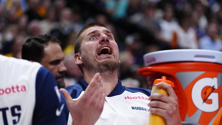 Apr 29, 2025; Denver, Colorado, USA; Denver Nuggets center Nikola Jokic (15) reacts from the bench in the fourth quarter against the LA Clippers during game five of the first round for the 2025 NBA Playoffs at Ball Arena. Mandatory Credit: Ron Chenoy-Imagn Images Apr 29, 2025; Denver, Colorado, USA; Denver Nuggets center Nikola Jokic (15) reacts from the bench in the fourth quarter against the LA Clippers during game five of the first round for the 2025 NBA Playoffs at Ball Arena. Mandatory Credit: Ron Chenoy-Imagn Images