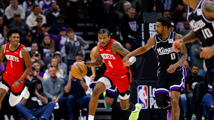 Jan 16, 2025; Sacramento, California, USA; Houston Rockets guard Jalen Green (4) dribbles the ball up the court against Sacramento Kings guard Malik Monk (0) during the fourth quarter at Golden 1 Center. Mandatory Credit: Sergio Estrada-Imagn Images Jan 16, 2025; Sacramento, California, USA; Houston Rockets guard Jalen Green (4) dribbles the ball up the court against Sacramento Kings guard Malik Monk (0) during the fourth quarter at Golden 1 Center. Mandatory Credit: Sergio Estrada-Imagn Images