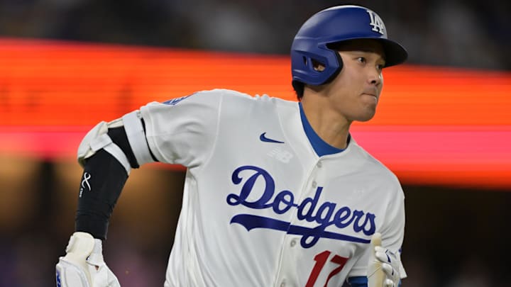 Apr 10, 2026; Los Angeles, California, USA; Los Angeles Dodgers two-way player Shohei Ohtani (17) singles in the fifth inning against the Texas Rangers at Dodger Stadium. Mandatory Credit: Jayne Kamin-Oncea-Imagn Images