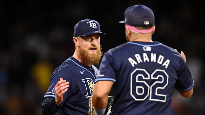 Tampa Bay Rays relief pitcher Drew Rasmussen (57) high-fives first baseman Jonathan Aranda (62) after a game against the Boston Red Sox at Fenway Park on Sept 28.