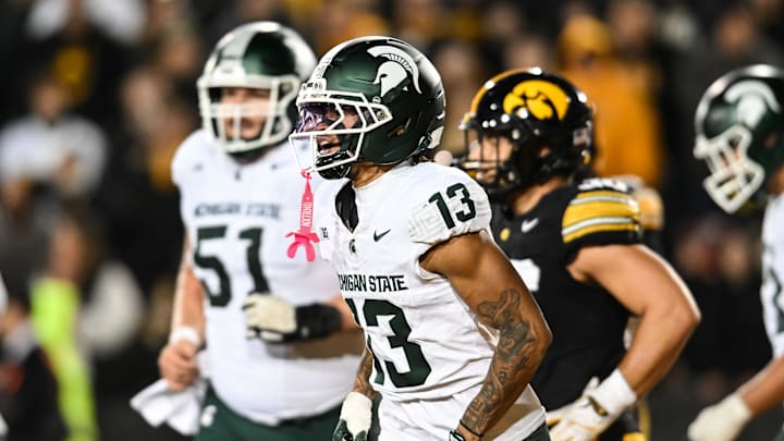 Nov 22, 2025; Iowa City, Iowa, USA; Michigan State Spartans wide receiver Chrishon McCray (13) reacts after a touchdown during the third quarter against the Iowa Hawkeyes at Kinnick Stadium. Mandatory Credit: Jeffrey Becker-Imagn Images