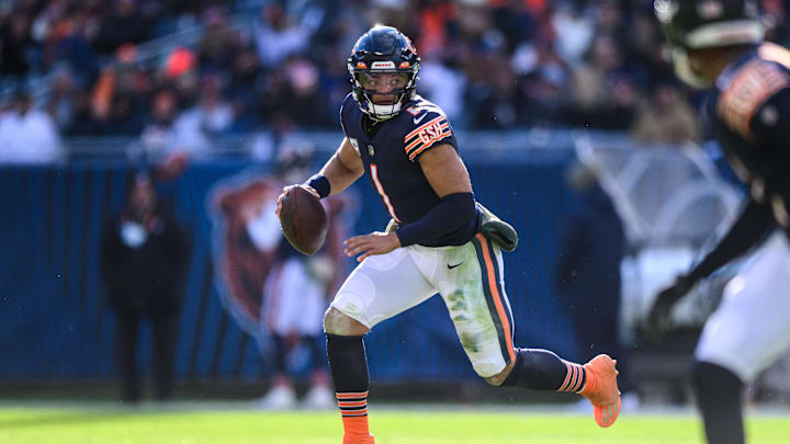 Nov 13, 2022; Chicago, Illinois, USA; Chicago Bears quarterback Justin Fields (1) scrambles right in