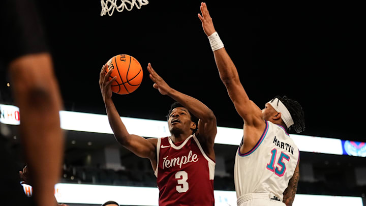 Mar 16, 2024; Fort Worth, TX, USA; Temple Owls guard Hysier Miller (3) scores a layup against Florida Atlantic Owls guard Alijah Martin (15) during the second half at Dickies Arena. Mandatory Credit: Chris Jones-Imagn Images