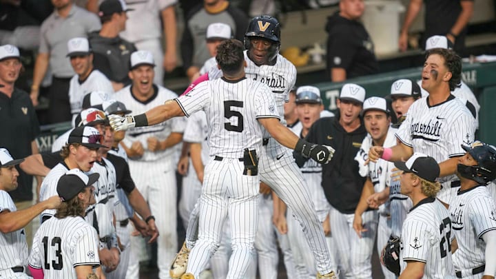 Vanderbilt infielder Mike Mancini (5) celebrates with Vanderbilt utility RJ Austin (42) after hitting a home run during a NCAA baseball game between the Tennessee Volunteers and Vanderbilt Commodores at Lindsey Nelson Stadium on May 11, 2025. Vanderbilt won 7-5 against Tennessee.
