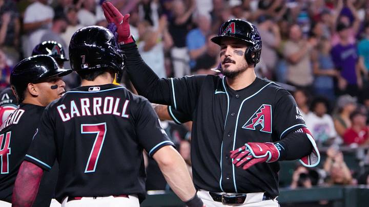 Arizona Diamondbacks third baseman Nolan Arenado celebrates a grand slam with teammates