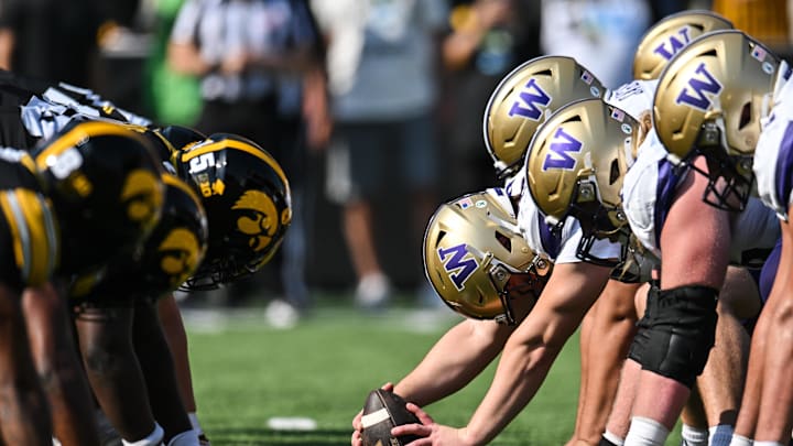 Oct 12, 2024; Iowa City, Iowa, USA; The line of scrimmage between the Iowa Hawkeyes and the Washington Huskies during the second quarter at Kinnick Stadium. Mandatory Credit: Jeffrey Becker-Imagn Images