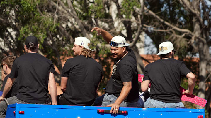 Dodgers pitcher Brusdar Graterol (48) celebrates with teammates on the bus during the 2024 World Series championship parade near Los Angeles City Hall on Nov. 1, 2024. Dodgers pitcher Brusdar Graterol (48) celebrates with teammates on the bus during the 2024 World Series championship parade near Los Angeles City Hall on Nov. 1, 2024.