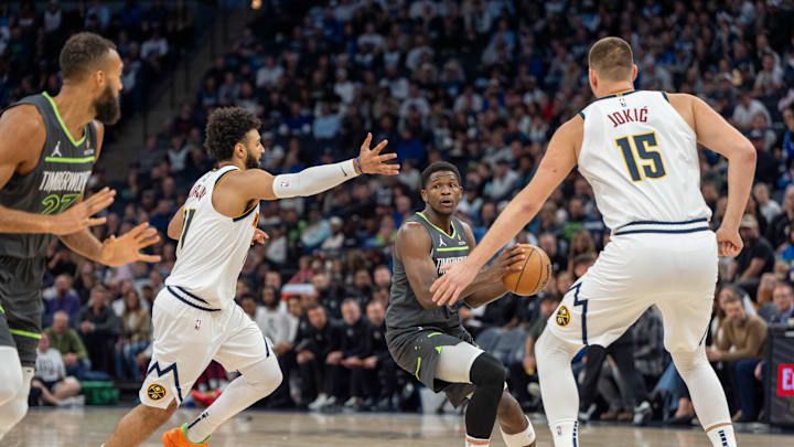 Minnesota Timberwolves guard Anthony Edwards (5) against Denver Nuggets guard Jamal Murray (27) and center Nikola Jokic (15) at Target Center. Minnesota Timberwolves guard Anthony Edwards (5) against Denver Nuggets guard Jamal Murray (27) and center Nikola Jokic (15) at Target Center.