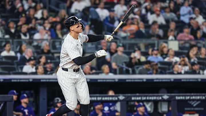 May 6, 2026; Bronx, New York, USA; New York Yankees right fielder Aaron Judge (99) hits a solo home run during the sixth inning against the Texas Rangers at Yankee Stadium. Mandatory Credit: Vincent Carchietta-Imagn Images