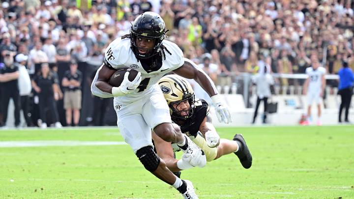 Sep 12, 2026; West Lafayette, Indiana, USA; Wake Forest Demon Deacons running back Ty Clark (4) gets away from Purdue Boilermakers defensive end Trey Smith (23) during the first quarter at Ross-Ade Stadium. Mandatory Credit: Marc Lebryk-Imagn Images Sep 12, 2026; West Lafayette, Indiana, USA; Wake Forest Demon Deacons running back Ty Clark (4) gets away from Purdue Boilermakers defensive end Trey Smith (23) during the first quarter at Ross-Ade Stadium. Mandatory Credit: Marc Lebryk-Imagn Images