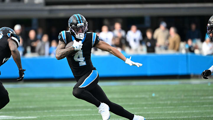Dec 21, 2025; Charlotte, North Carolina, USA; Carolina Panthers wide receiver Tetairoa McMillan (4) with the ball in the third quarter at Bank of America Stadium. Mandatory Credit: Bob Donnan-Imagn Images Dec 21, 2025; Charlotte, North Carolina, USA; Carolina Panthers wide receiver Tetairoa McMillan (4) with the ball in the third quarter at Bank of America Stadium. Mandatory Credit: Bob Donnan-Imagn Images