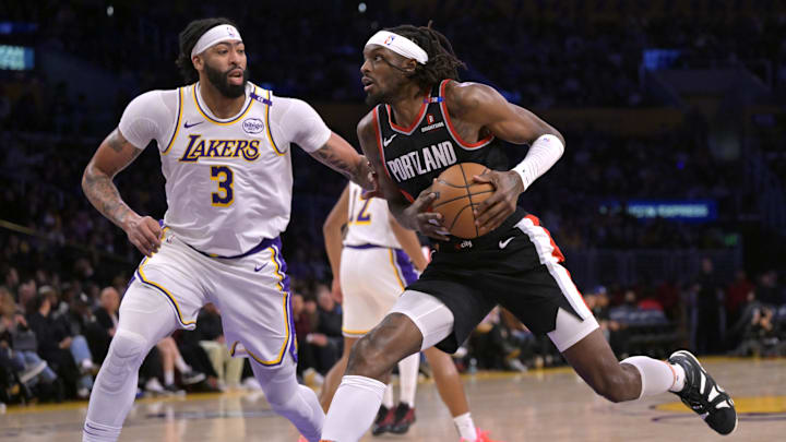 Dec 8, 2024; Los Angeles, California, USA;  Portland Trail Blazers forward Jerami Grant (9) drives past Los Angeles Lakers forward Anthony Davis (3) in the first half at Crypto.com Arena. Mandatory Credit: Jayne Kamin-Oncea-Imagn Images