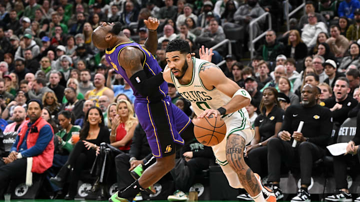Mar 8, 2025; Boston, Massachusetts, USA; Los Angeles Lakers forward LeBron James (23) reacts after being fouled by Boston Celtics forward Jayson Tatum (0) during the fourth quarter at the TD Garden. Mandatory Credit: Brian Fluharty-Imagn Images