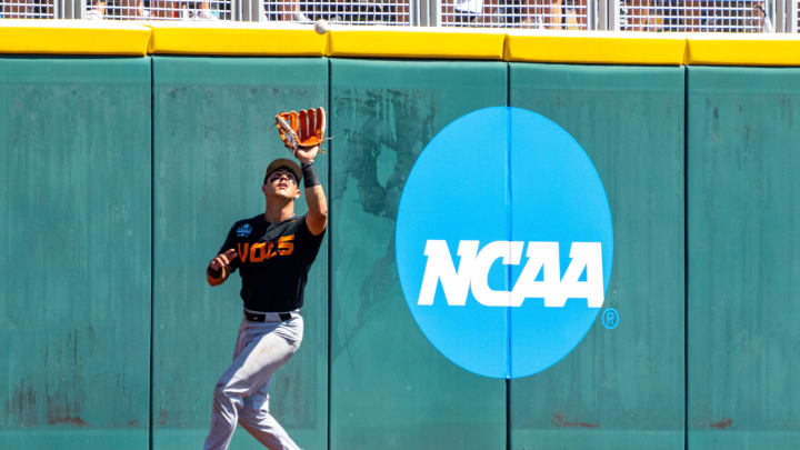 Jun 23, 2024; Omaha, NE, USA; Tennessee Volunteers center fielder Hunter Ensley (9) makes a catch against the Texas A&M Aggies during the sixth inning at Charles Schwab Field Omaha. Mandatory Credit: Dylan Widger-USA TODAY Sports Jun 23, 2024; Omaha, NE, USA; Tennessee Volunteers center fielder Hunter Ensley (9) makes a catch against the Texas A&M Aggies during the sixth inning at Charles Schwab Field Omaha. Mandatory Credit: Dylan Widger-USA TODAY Sports
