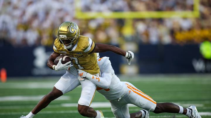 Sep 12, 2026; Atlanta, Georgia, USA; Georgia Tech Yellow Jackets wide receiver Dalen Penson (7) is tackled by Tennessee Volunteers defensive back Ty Redmond (4) in the first quarter at Bobby Dodd Stadium at Hyundai Field. Mandatory Credit: Brett Davis-Imagn Images Sep 12, 2026; Atlanta, Georgia, USA; Georgia Tech Yellow Jackets wide receiver Dalen Penson (7) is tackled by Tennessee Volunteers defensive back Ty Redmond (4) in the first quarter at Bobby Dodd Stadium at Hyundai Field. Mandatory Credit: Brett Davis-Imagn Images