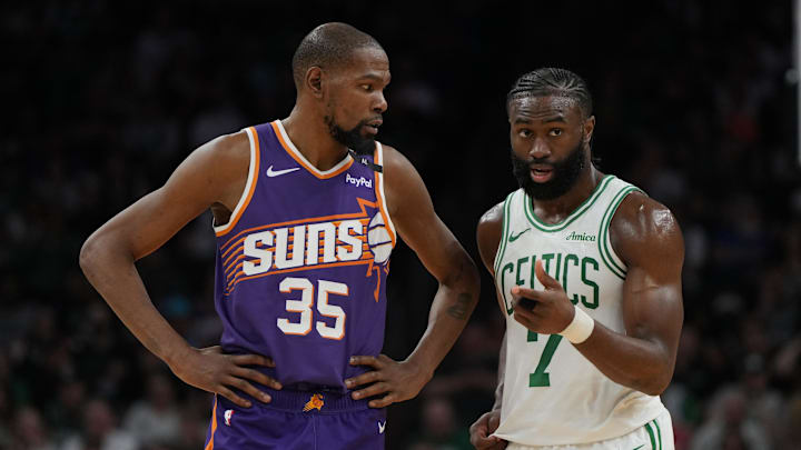 Mar 26, 2025; Phoenix, Arizona, USA; Phoenix Suns forward Kevin Durant (35) and Boston Celtics guard Jaylen Brown (7) talk during the second half at Footprint Center. Mandatory Credit: Rick Scuteri-Imagn Images