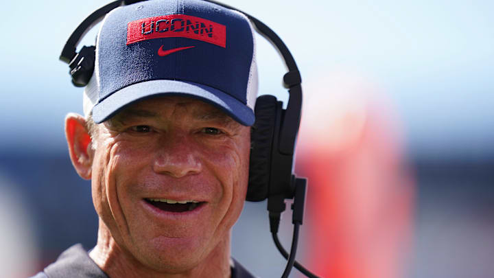 Aug 30, 2025; East Hartford, Connecticut, USA; Connecticut Huskies head coach Jim Mora watches from the sideline as they take on the Central Connecticut State Blue Devils at Pratt & Whitney Stadium at Rentschler Field. Mandatory Credit: David Butler II-Imagn Images Aug 30, 2025; East Hartford, Connecticut, USA; Connecticut Huskies head coach Jim Mora watches from the sideline as they take on the Central Connecticut State Blue Devils at Pratt & Whitney Stadium at Rentschler Field. Mandatory Credit: David Butler II-Imagn Images