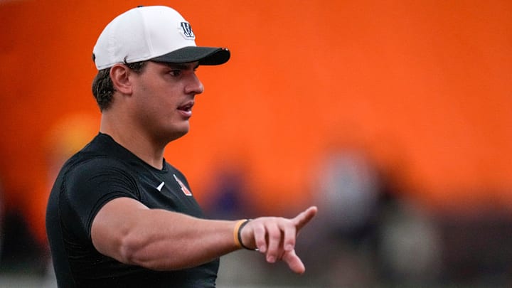 Cincinnati Bengals defensive end Trey Hendrickson (91) assists with drills during a preseason training camp practice in downtown Cincinnati on Thursday, July 31, 2025. Cincinnati Bengals defensive end Trey Hendrickson (91) assists with drills during a preseason training camp practice in downtown Cincinnati on Thursday, July 31, 2025.