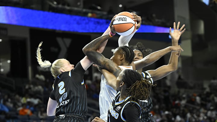Jun 21, 2025; Chicago, Illinois, USA;  Phoenix Mercury forward Natasha Mack (4)  shoots against Chicago Sky guard Hailey Van Lith (2), guard Ariel Atkins (7) and  center Elizabeth Williams (1) during the first half at Wintrust Arena. Mandatory Credit: Matt Marton-Imagn Images