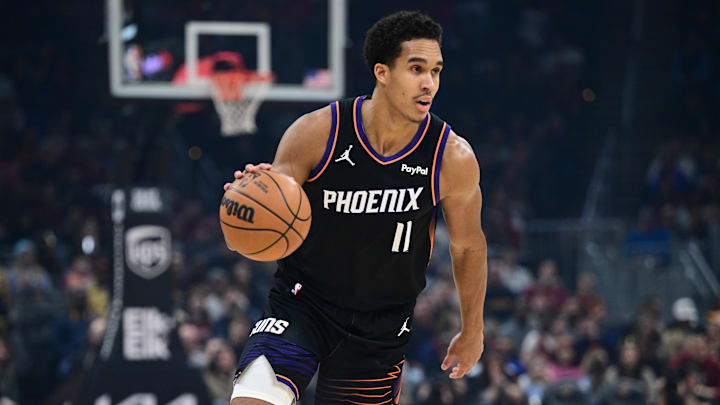 Dec 31, 2025; Cleveland, Ohio, USA; Phoenix Suns forward Oso Ighodaro (11) dribbles up court during the first half against the Cleveland Cavaliers at Rocket Arena. Mandatory Credit: David Dermer-Imagn Images
