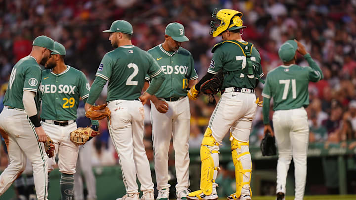 Jul 11, 2025; Boston, Massachusetts, USA; Boston Red Sox manager Alex Cora (13) relieves pitcher Jorge Alcala (71) in the third inning against the Tampa Bay Rays at Fenway Park. Mandatory Credit: David Butler II-Imagn Images