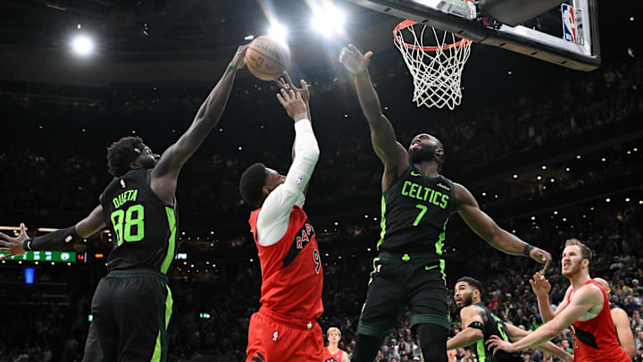 Nov 16, 2024; Boston, Massachusetts, USA; Boston Celtics center Neemias Queta (88) and guard Jaylen Brown (7) defend Toronto Raptors guard RJ Barrett (9) during the second half at the TD Garden. Mandatory Credit: Brian Fluharty-Imagn Images Nov 16, 2024; Boston, Massachusetts, USA; Boston Celtics center Neemias Queta (88) and guard Jaylen Brown (7) defend Toronto Raptors guard RJ Barrett (9) during the second half at the TD Garden. Mandatory Credit: Brian Fluharty-Imagn Images