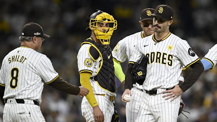 Oct 9, 2024; San Diego, California, USA; San Diego Padres manager Mike Shildt (8) takes out pitcher Dylan Cease (84) in the second inning against the Los Angeles Dodgers during game four of the NLDS for the 2024 MLB Playoffs at Petco Park.  Mandatory Credit: Denis Poroy-Imagn Images