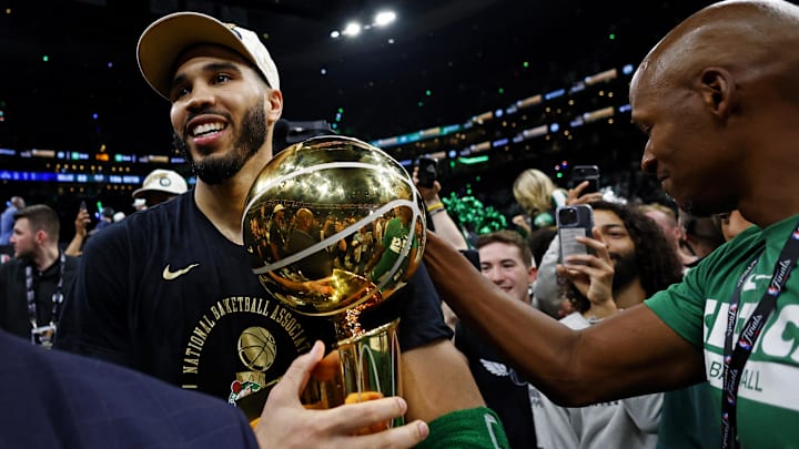 Boston Celtics forward Jayson Tatum celebrates with the Larry O’Brien Trophy after beating the Dallas Mavericks in game five of the 2024 NBA Finals to win the NBA Championship at TD Garden.