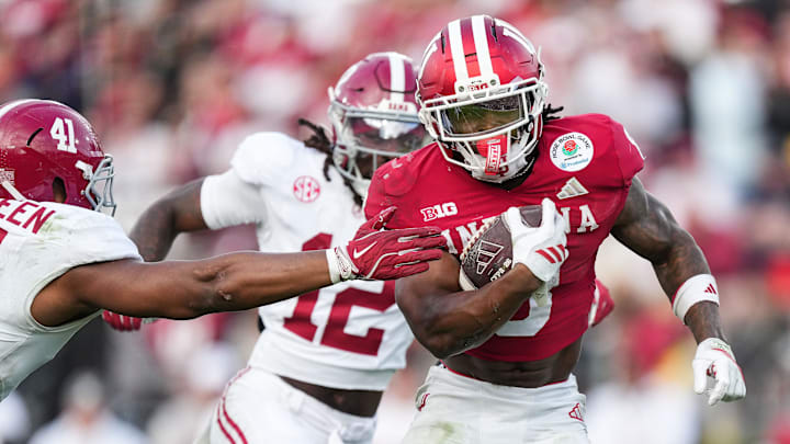Indiana running back Kaelon Black secures the football while rushing against Alabama in the Rose Bowl. Indiana running back Kaelon Black secures the football while rushing against Alabama in the Rose Bowl.
