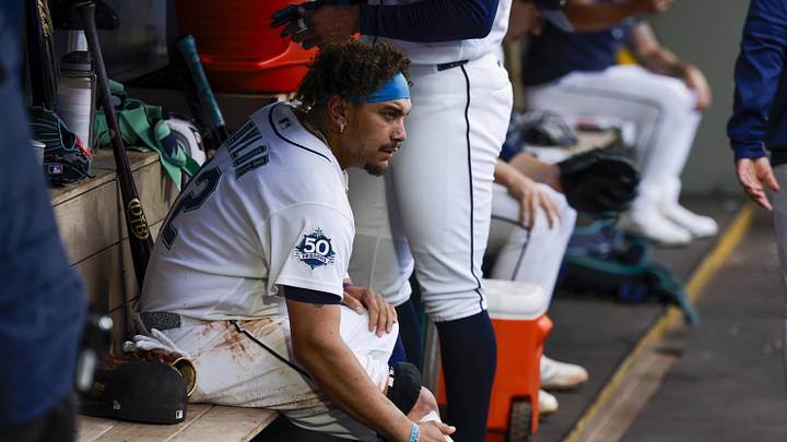 May 19, 2026; Seattle, Washington, USA; Seattle Mariners first baseman Josh Naylor (12) tends to a cut to his lower leg suffered while base running against the Chicago White Sox during the first inning at T-Mobile Park. Mandatory Credit: Joe Nicholson-Imagn Images