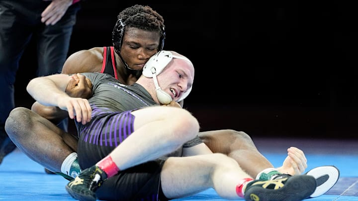 Brownsburg's Gunner Henry competes against Lawrence North's Michael White in the 190-pound bout Saturday, Feb. 22, 2025, during the IHSAA boys wrestling state finals at Gainbridge Fieldhouse in Indianapolis.