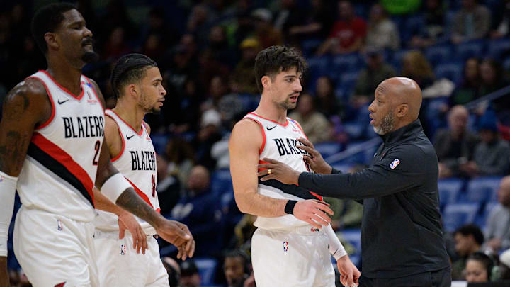 Jan 8, 2025; New Orleans, Louisiana, USA; Portland Trail Blazers head coach Chauncey Billups talks with forward Deni Avdija (8), next to forward Toumani Camara (33) and center Deandre Ayton (2) against the Portland Trail Blazers during the first half at Smoothie King Center. Mandatory Credit: Matthew Hinton-Imagn Images Jan 8, 2025; New Orleans, Louisiana, USA; Portland Trail Blazers head coach Chauncey Billups talks with forward Deni Avdija (8), next to forward Toumani Camara (33) and center Deandre Ayton (2) against the Portland Trail Blazers during the first half at Smoothie King Center. Mandatory Credit: Matthew Hinton-Imagn Images