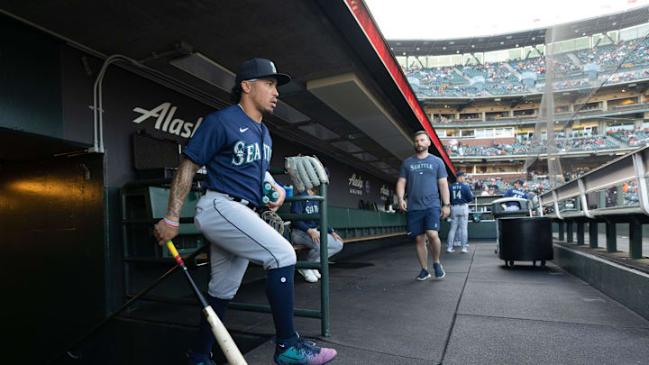 Seattle Mariners second baseman Kolten Wong (16) walks into the dugout before the start of the first inning against the San Francisco Giants at Oracle Park on July 3. Seattle Mariners second baseman Kolten Wong (16) walks into the dugout before the start of the first inning against the San Francisco Giants at Oracle Park on July 3.