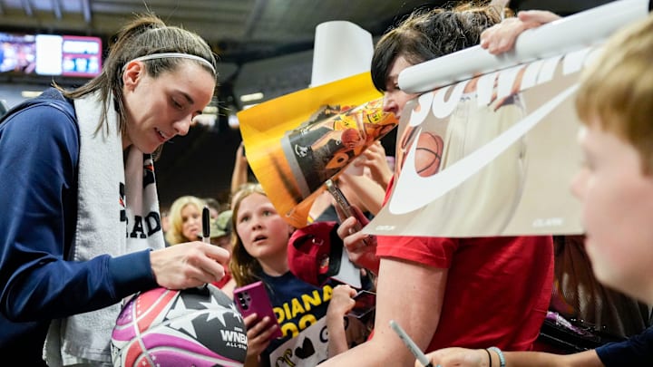 Indiana Fever guard Caitlin Clark (22) signs autographs for fans after the Fever defeated Brazil in a preseason game May 4, 2025 at Carver-Hawkeye Arena in Iowa City, Iowa. Indiana Fever guard Caitlin Clark (22) signs autographs for fans after the Fever defeated Brazil in a preseason game May 4, 2025 at Carver-Hawkeye Arena in Iowa City, Iowa.